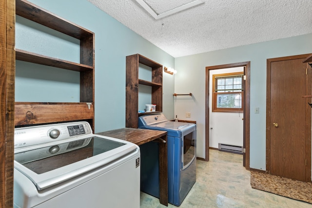 laundry room with a textured ceiling, a baseboard radiator, laundry area, light floors, and separate washer and dryer