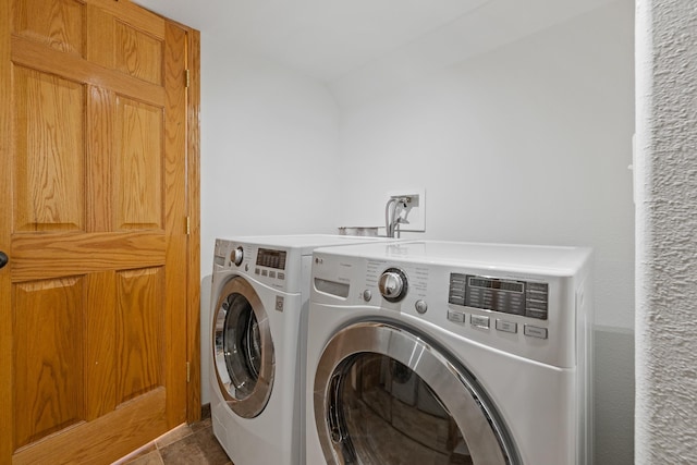 laundry area featuring washer and dryer and laundry area