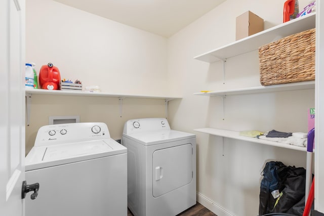 washroom with washer and clothes dryer, laundry area, and baseboards