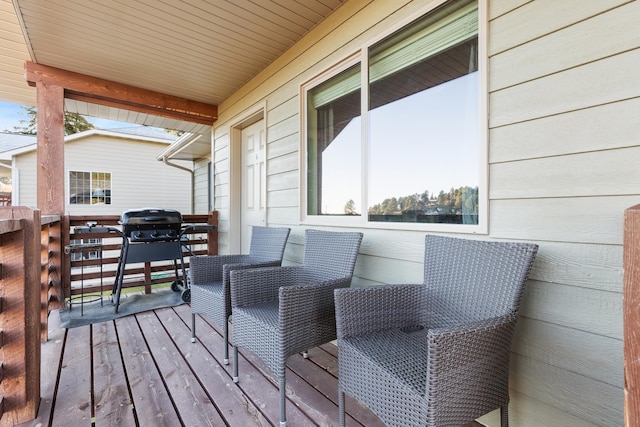 wooden terrace with area for grilling