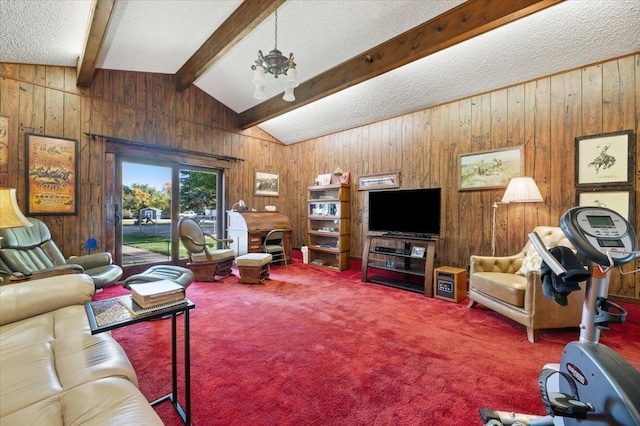 living area with a textured ceiling, wooden walls, lofted ceiling with beams, and carpet