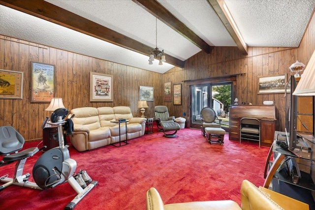 carpeted living room with wood walls, a textured ceiling, and vaulted ceiling with beams
