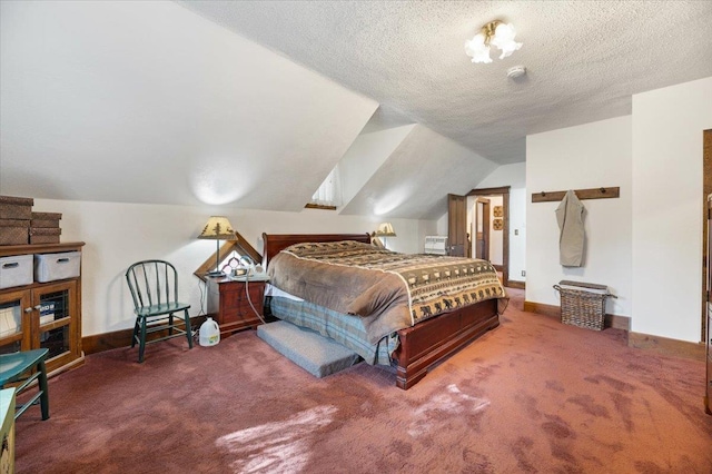 carpeted bedroom with baseboards, vaulted ceiling, and a textured ceiling