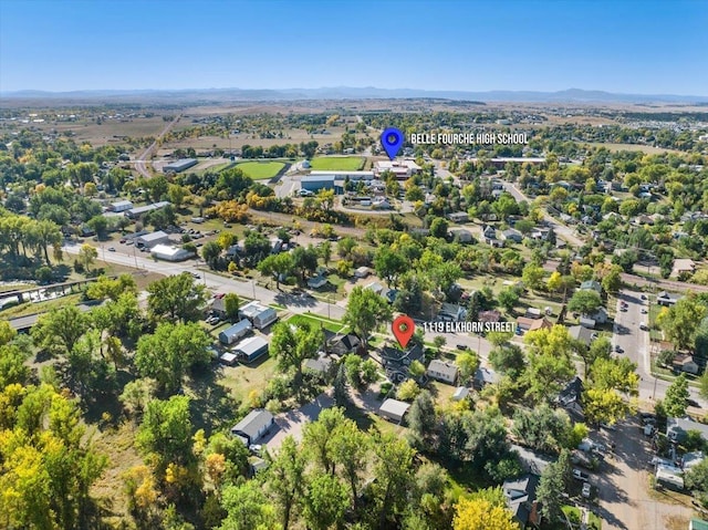 birds eye view of property featuring a mountain view