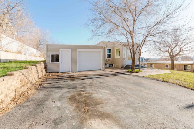 1227 S Street, Rapid City, SD 57701 - view of front of property featuring an attached garage and driveway