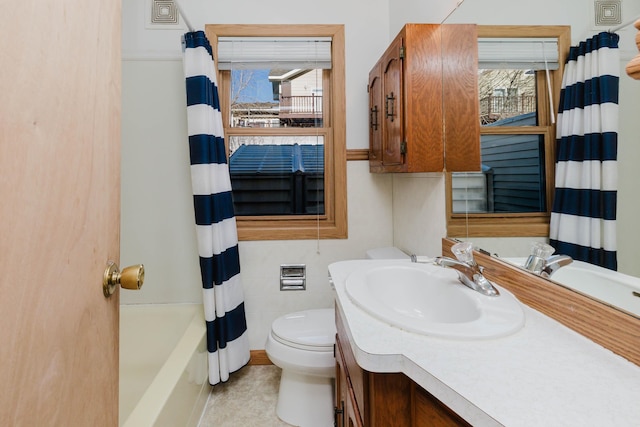 1227 S Street, Rapid City, SD 57701 - bathroom with toilet, vanity, shower / bath combination with curtain, and a wealth of natural light
