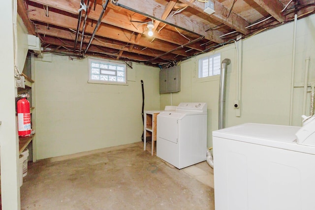 1227 S Street, Rapid City, SD 57701 - clothes washing area with laundry area, washing machine and clothes dryer, electric panel, and a wealth of natural light