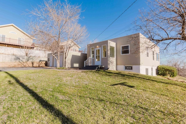1227 S Street, Rapid City, SD 57701 - back of property with an outbuilding, stucco siding, a lawn, a storage unit, and fence