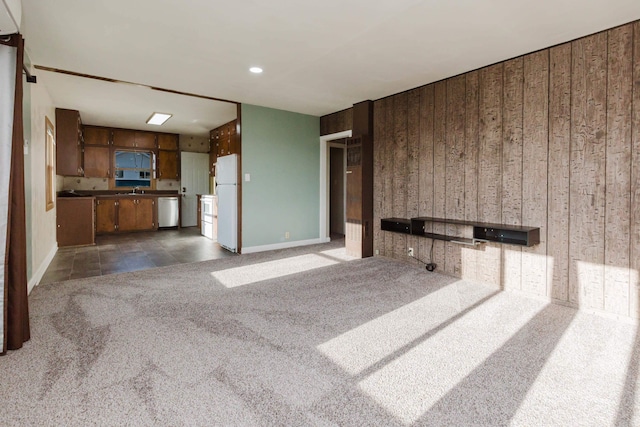 1227 S Street, Rapid City, SD 57701 - unfurnished living room with carpet floors and baseboards