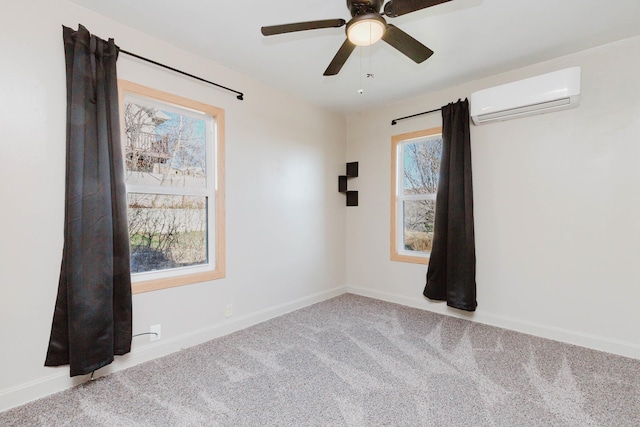 1227 S Street, Rapid City, SD 57701 - carpeted empty room featuring a wealth of natural light, ceiling fan, baseboards, and a wall mounted air conditioner
