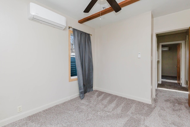 1227 S Street, Rapid City, SD 57701 - unfurnished room with an AC wall unit, ceiling fan, carpet, and baseboards