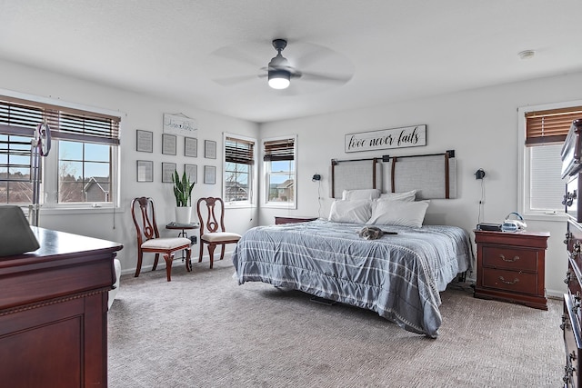 bedroom with baseboards, a ceiling fan, and carpet flooring