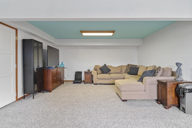 living room with baseboards and light colored carpet