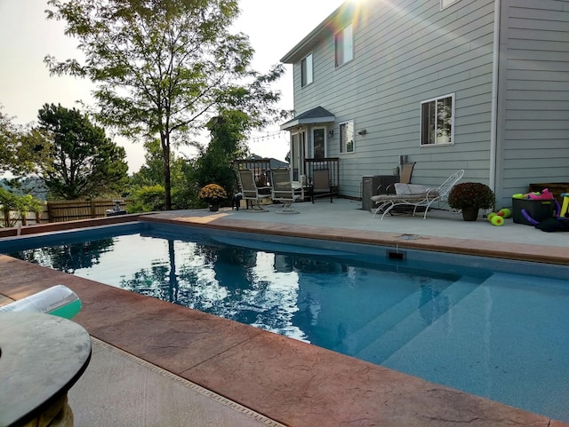 view of pool featuring fence, a patio area, and a fenced in pool