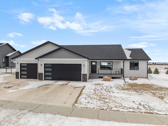 2334 Talisker Ave, Spearfish, SD 57783 - view of front of property featuring a garage, roof with shingles, a porch, and driveway