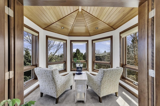 sunroom / solarium featuring wooden ceiling, carpet flooring, and plenty of natural light