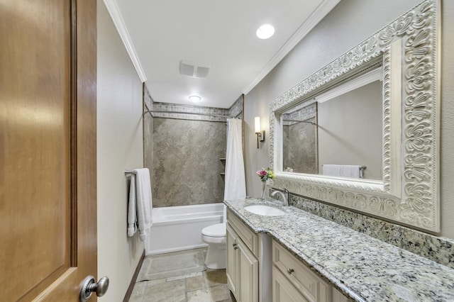 bathroom featuring toilet, vanity, ornamental molding, and stone tile flooring