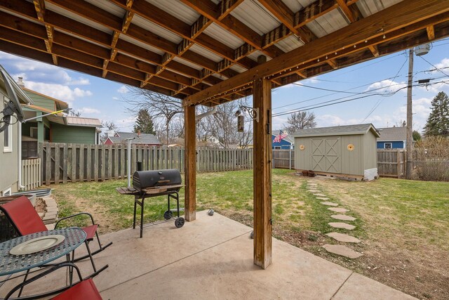 4101 Pleasant Dr, Rapid City, SD 57702 - view of patio featuring area for grilling, an outbuilding, a shed, and a fenced backyard