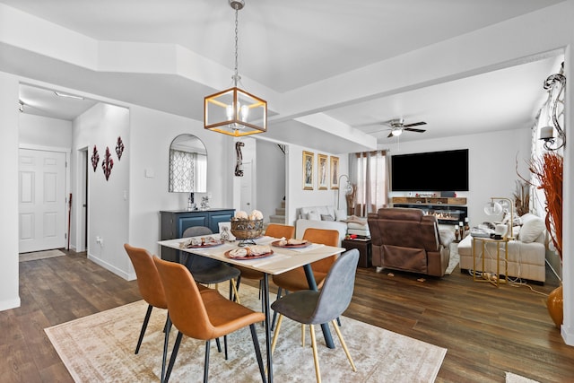 552 Other, Rapid City, SD 57703 - dining room featuring ceiling fan with notable chandelier, a wealth of natural light, baseboards, and dark wood-style floors