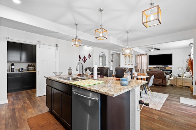 552 Other, Rapid City, SD 57703 - kitchen with stainless steel dishwasher, open floor plan, dark wood-style flooring, and a barn door