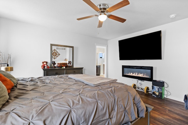 552 Other, Rapid City, SD 57703 - bedroom featuring wood finished floors, ceiling fan, ensuite bath, and a glass covered fireplace
