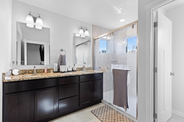 552 Other, Rapid City, SD 57703 - bathroom with tile patterned flooring, double vanity, a sink, and a stall shower