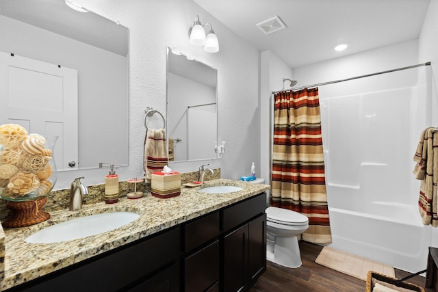 552 Other, Rapid City, SD 57703 - bathroom featuring visible vents, a sink, toilet, and wood finished floors