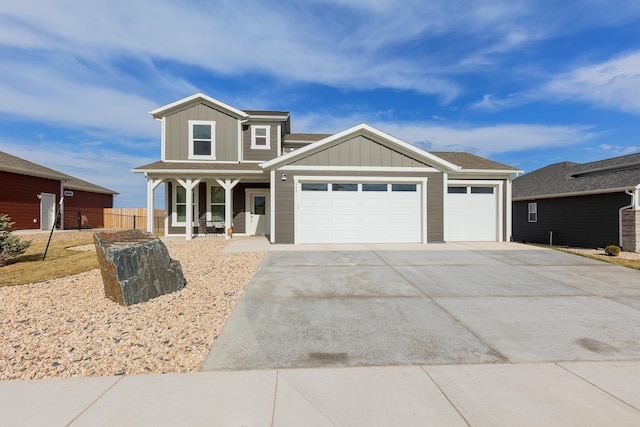 552 Other, Rapid City, SD 57703 - view of front of house featuring board and batten siding, concrete driveway, a garage, and covered porch