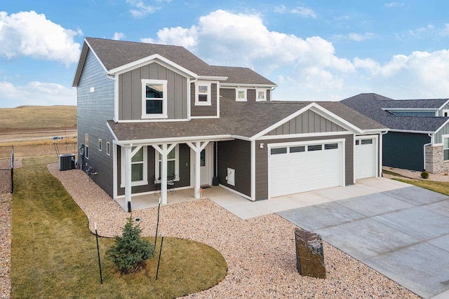 552 Other, Rapid City, SD 57703 - traditional home featuring board and batten siding, an attached garage, central AC, and concrete driveway