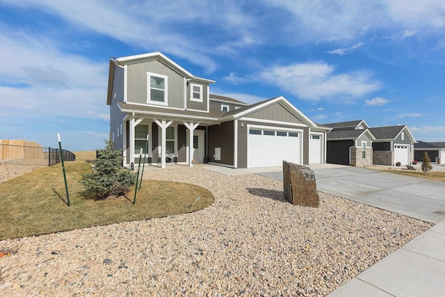 552 Other, Rapid City, SD 57703 - view of front of home featuring a garage, board and batten siding, fence, and concrete driveway