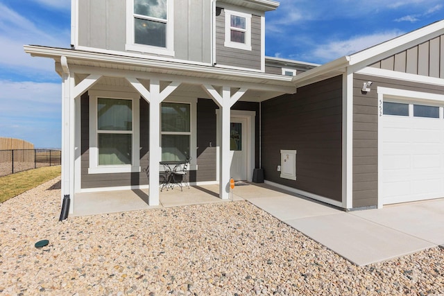 552 Other, Rapid City, SD 57703 - exterior space with board and batten siding, a porch, fence, and a garage