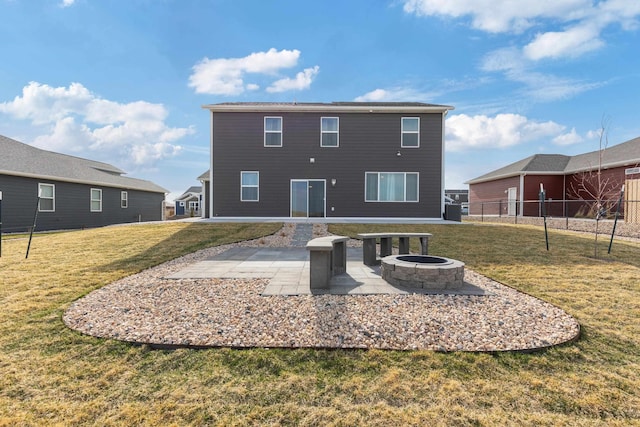 552 Other, Rapid City, SD 57703 - back of property with fence, a fire pit, a patio, and a lawn