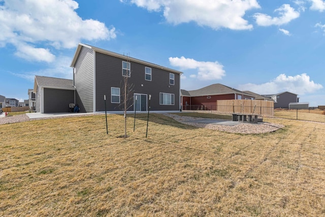 552 Other, Rapid City, SD 57703 - rear view of house with a yard, driveway, a garage, and fence