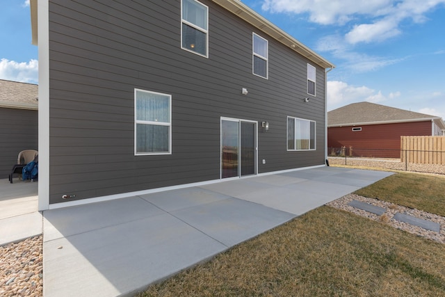 552 Other, Rapid City, SD 57703 - rear view of house featuring a patio area and fence