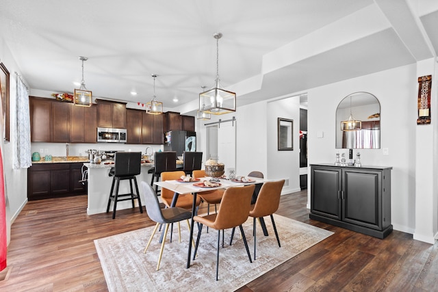 552 Other, Rapid City, SD 57703 - dining space featuring dark wood-style flooring, baseboards, recessed lighting, and a barn door