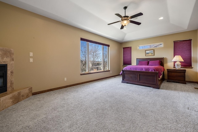 6627 Kennemer Dr, Rapid City, SD 57702 - bedroom featuring baseboards, recessed lighting, carpet flooring, a tray ceiling, and a high end fireplace