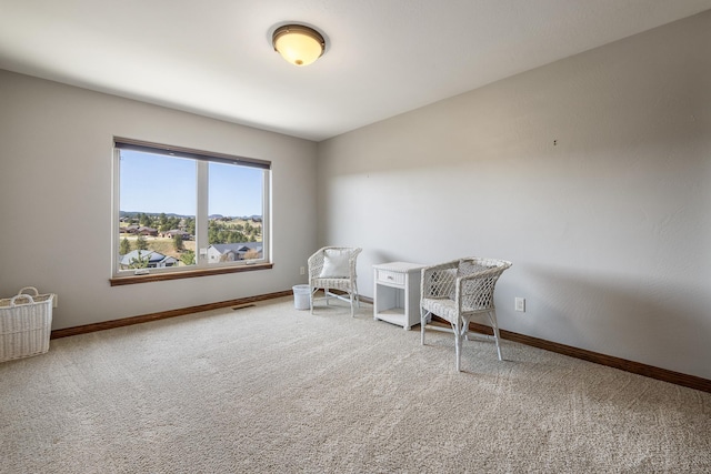 6627 Kennemer Dr, Rapid City, SD 57702 - sitting room featuring carpet flooring, baseboards, and visible vents