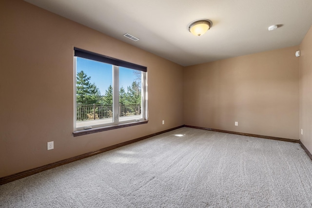 6627 Kennemer Dr, Rapid City, SD 57702 - empty room featuring visible vents, baseboards, and carpet