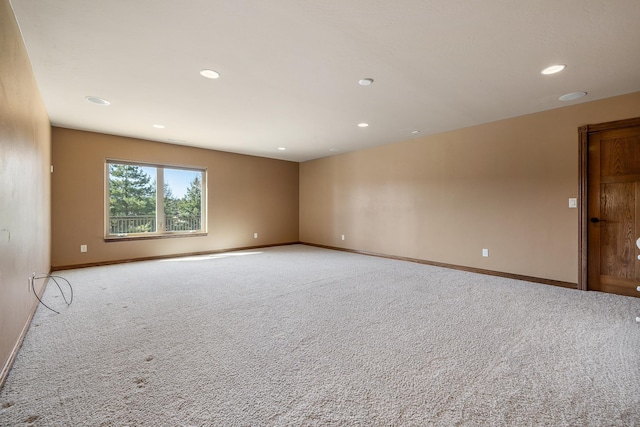 6627 Kennemer Dr, Rapid City, SD 57702 - unfurnished room with baseboards, recessed lighting, and light carpet