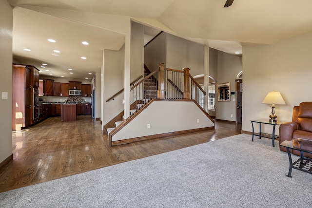 6627 Kennemer Dr, Rapid City, SD 57702 - living area with recessed lighting, stairway, dark wood-style floors, and baseboards