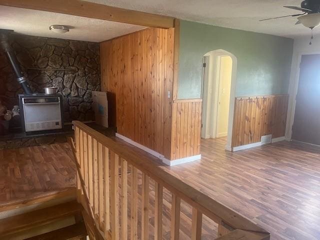 1021 Omaha St, Belle Fourche, SD 57717 - interior space featuring arched walkways, wood walls, and wood finished floors