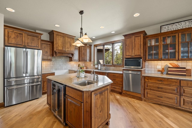 2724 Diamond Oak Pl, Rapid City, SD 57702 - kitchen featuring a sink, brown cabinets, wine cooler, and stainless steel appliances