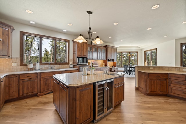 2724 Diamond Oak Pl, Rapid City, SD 57702 - kitchen featuring light wood-style flooring, a sink, beverage cooler, and recessed lighting