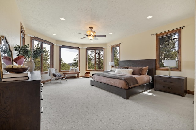 2724 Diamond Oak Pl, Rapid City, SD 57702 - bedroom featuring a textured ceiling, recessed lighting, multiple windows, and carpet floors