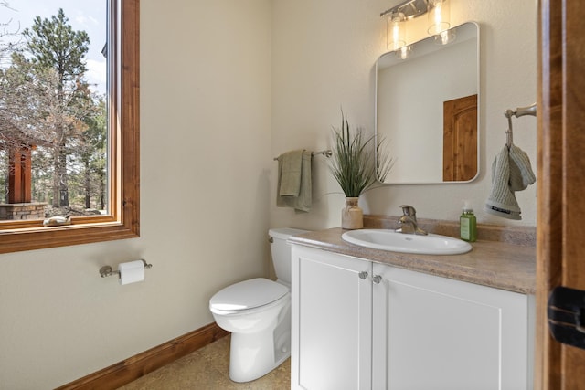 2724 Diamond Oak Pl, Rapid City, SD 57702 - half bath featuring vanity, baseboards, and toilet