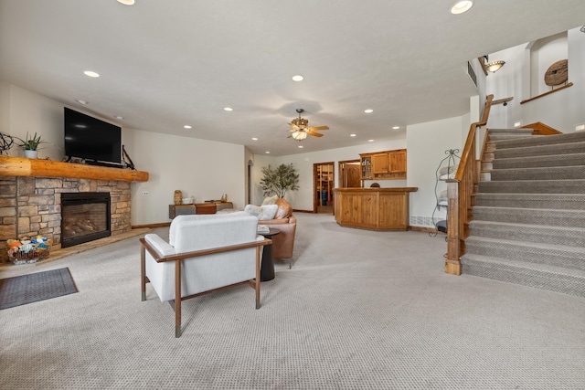 2724 Diamond Oak Pl, Rapid City, SD 57702 - living room featuring ceiling fan, a fireplace, light colored carpet, recessed lighting, and stairs