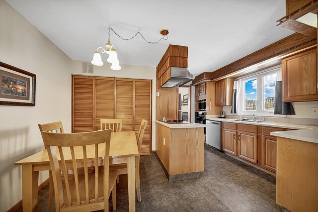 1106 Allen St, Rapid City, SD 57701 - kitchen with a chandelier, light countertops, under cabinet range hood, visible vents, and stainless steel dishwasher