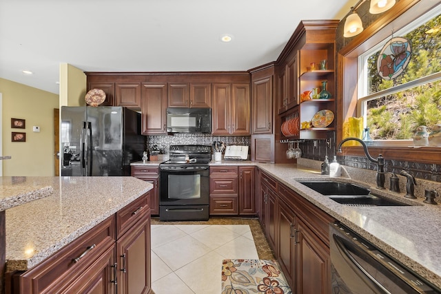 11583 Pay Dirt Pass, Custer, SD 57730 - kitchen featuring tasteful backsplash, light tile patterned floors, a sink, and black appliances