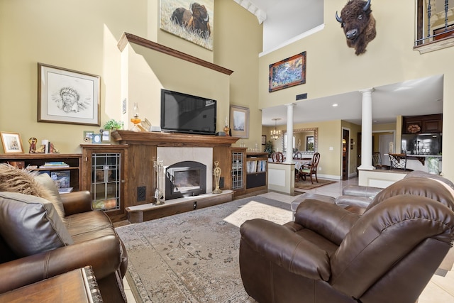 11583 Pay Dirt Pass, Custer, SD 57730 - living area with decorative columns, visible vents, baseboards, a towering ceiling, and a high end fireplace