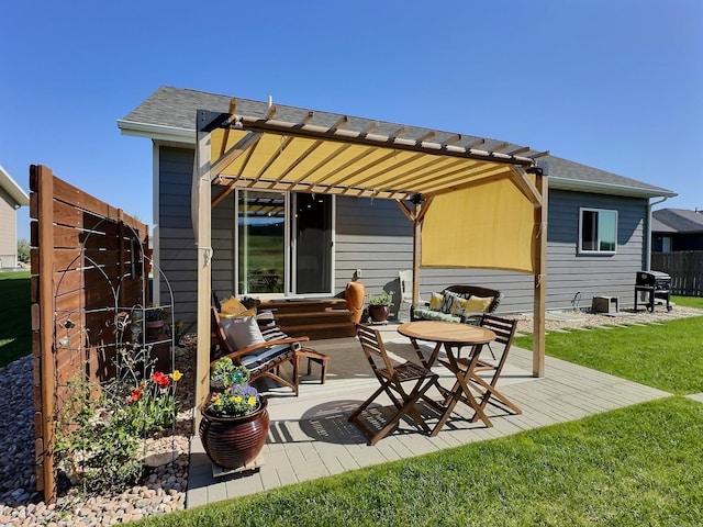 rear view of property with a pergola, a patio area, and a shingled roof